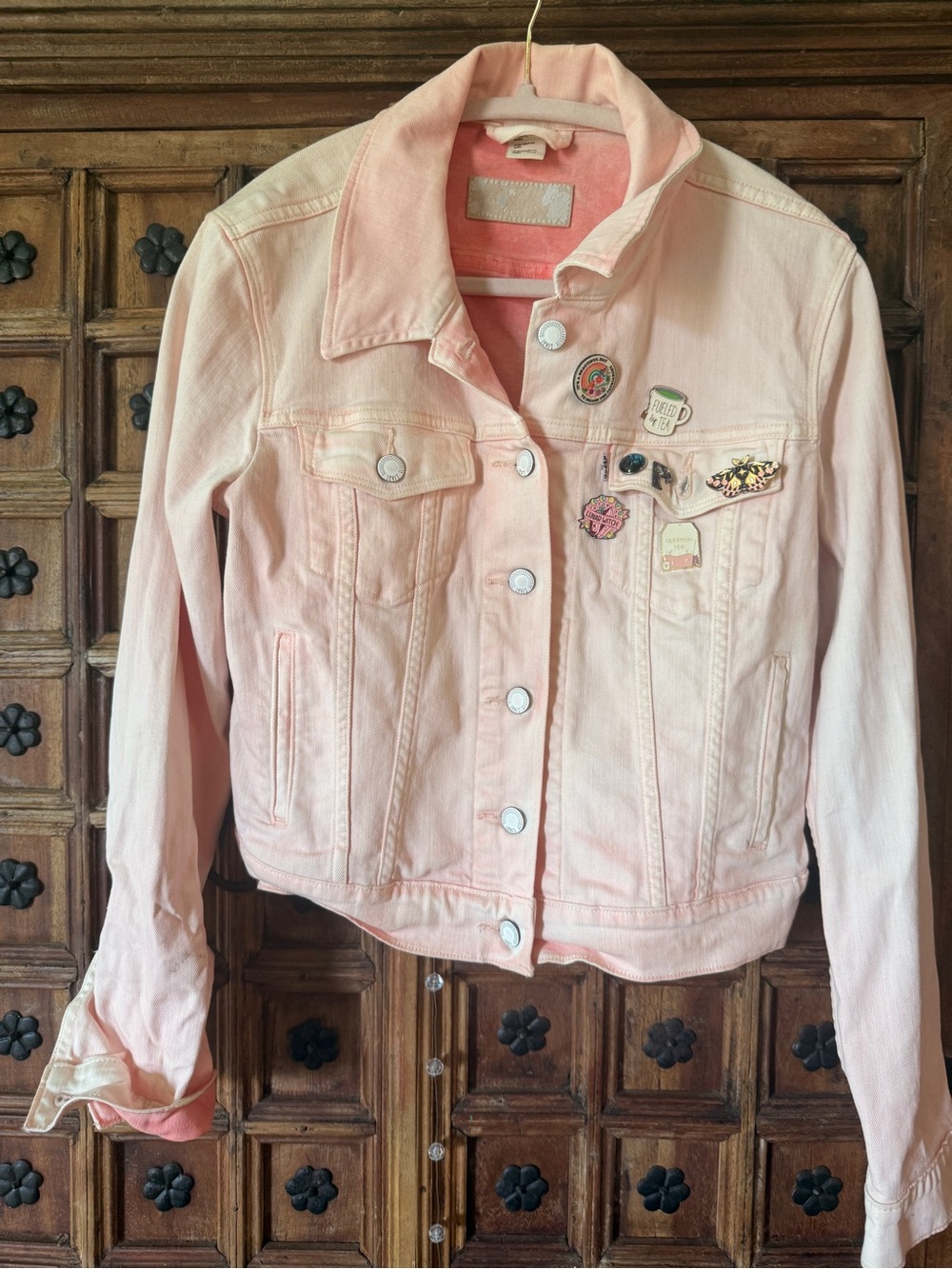 Levi's light pink ombré denim jacket with enamel pin cluster